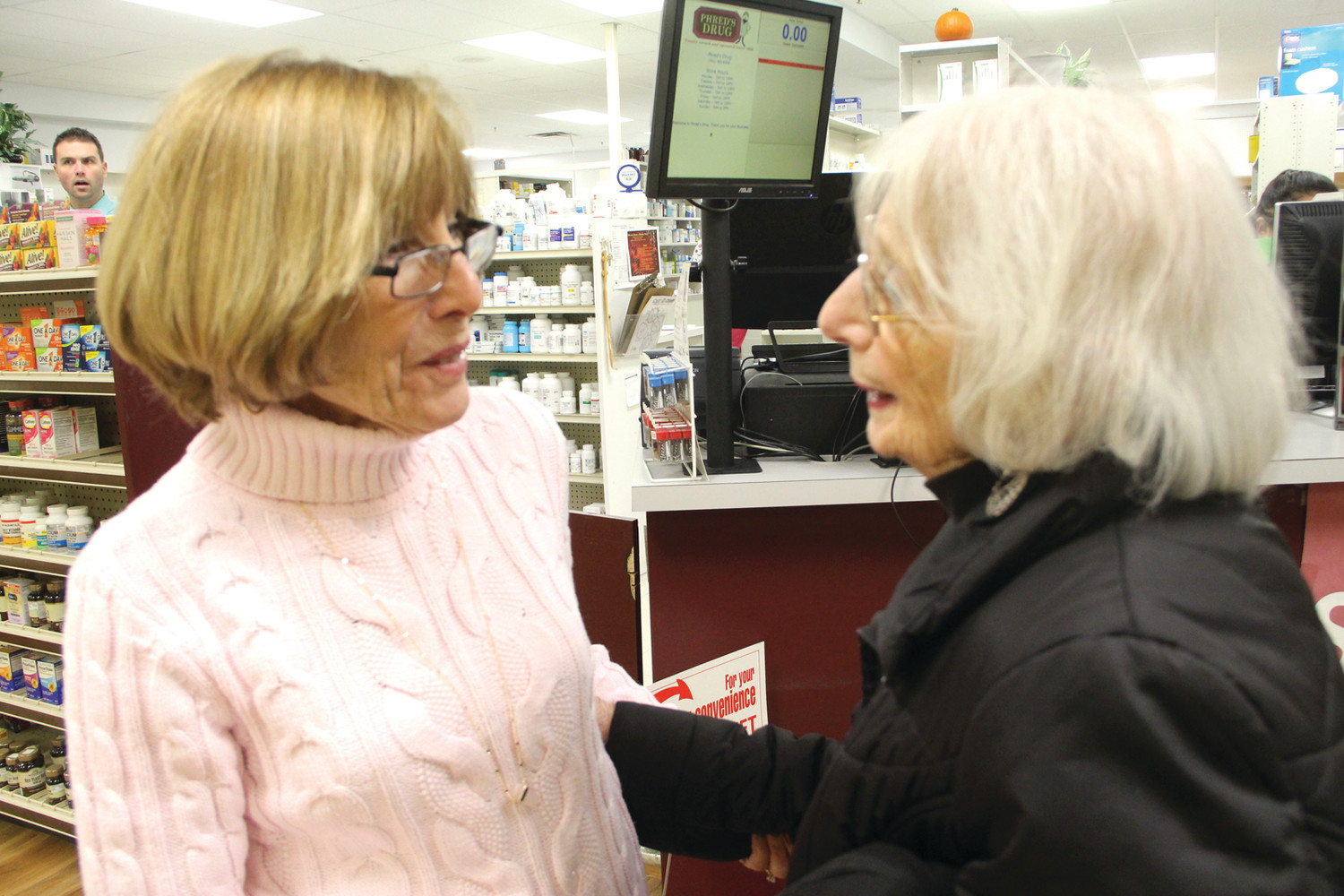 HOW IT IS CHANGING: Jean Ricci, left, talks with customer Shirley Ladd about the pending closure of Phred’s Drug.